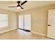 Bright bedroom with a ceiling fan and sliding glass door to let in natural light at 5009 Jody Ave, North Port, FL 34288