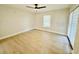 This bedroom has hardwood floors, a fan and lots of natural light at 5009 Jody Ave, North Port, FL 34288