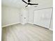 Spacious bedroom with a ceiling fan and double door closet at 5009 Jody Ave, North Port, FL 34288