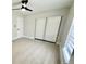 Cozy bedroom featuring a ceiling fan, natural light, and new flooring at 5009 Jody Ave, North Port, FL 34288
