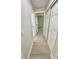 Hallway view showcasing the interior doors and clean, wood-look flooring at 5009 Jody Ave, North Port, FL 34288