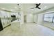 Bright, open kitchen with modern appliances, a stylish island, and ample cabinet space at 5009 Jody Ave, North Port, FL 34288
