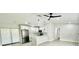 Bright kitchen featuring stainless steel appliances, white cabinetry, granite countertops, and a view to the living space at 5009 Jody Ave, North Port, FL 34288