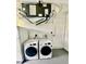 Laundry room with washer, dryer and utility sink at 5009 Jody Ave, North Port, FL 34288