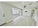 Bright, open living room with fresh paint, modern ceiling fan, and ample natural light at 5009 Jody Ave, North Port, FL 34288