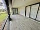 Covered and screened-in patio with a view of the surrounding landscape at 5009 Jody Ave, North Port, FL 34288