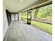 Spacious screened-in patio with sliding doors offering serene outdoor views at 5009 Jody Ave, North Port, FL 34288