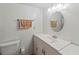 Clean bathroom featuring a modern sink, vanity, toilet, and neutral color scheme at 508 50Th Avenue W Plz, Bradenton, FL 34207