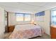 Cozy bedroom featuring a comfortable bed, soft lighting, and a peaceful ambiance at 508 50Th Avenue W Plz, Bradenton, FL 34207
