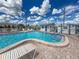 Relax by the inviting community pool with lounge chairs and clear blue water under sunny skies at 508 50Th Avenue W Plz, Bradenton, FL 34207