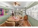 Bright dining area with a wooden table, seating for four, and views into other rooms of the house at 508 50Th Avenue W Plz, Bradenton, FL 34207