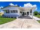 Inviting home exterior with a covered porch and well-maintained lawn and features a long driveway for easy parking at 508 50Th Avenue W Plz, Bradenton, FL 34207