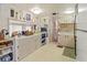Functional kitchen with white cabinets, open layout to other rooms and features ample storage and counter space at 508 50Th Avenue W Plz, Bradenton, FL 34207