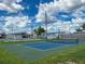 A beautiful community featuring a pickleball court for friendly games under a sunny, cloudy sky at 508 50Th Avenue W Plz, Bradenton, FL 34207