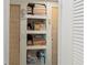 Floor to ceiling linen closet with neatly organized shelves and an array of linens at 508 50Th Avenue W Plz, Bradenton, FL 34207