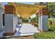 Backyard patio with pergola, brick columns, and view of the backyard landscaping at 528 Manor Dr, Dunedin, FL 34698