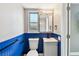 Bathroom view showing vanity, toilet, natural light, and stand up shower with marble-like tiles at 528 Manor Dr, Dunedin, FL 34698