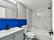 Bathroom featuring modern finishes and fixtures, including a shower with marble-like tiles at 528 Manor Dr, Dunedin, FL 34698
