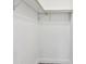 Image of walk in closet with white walls and hardwood floors at 528 Manor Dr, Dunedin, FL 34698