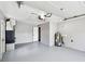 Spacious garage with water heater, utility system, and door leading to house at 528 Manor Dr, Dunedin, FL 34698