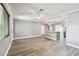 Spacious living area boasts new flooring and neutral paint, flowing into a modern kitchen with a large island at 528 Manor Dr, Dunedin, FL 34698