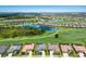 Expansive aerial view of the community highlighting the beautiful lakes, golf course, and residential homes at 5804 Mulligan Way, Lakewood Ranch, FL 34211