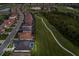 An aerial view displays golf course frontage and lush landscaping at 5804 Mulligan Way, Lakewood Ranch, FL 34211