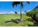 Well-maintained backyard showcasing lush green grass and scenic views of the golf course at 5804 Mulligan Way, Lakewood Ranch, FL 34211