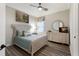Cozy bedroom with a comfortable bed, soft lighting, and stylish decor at 5804 Mulligan Way, Lakewood Ranch, FL 34211