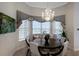 Cozy dining area featuring a chandelier, window seating, and elegant decor at 5804 Mulligan Way, Lakewood Ranch, FL 34211