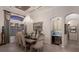 Elegant dining room with coffered ceilings, chandelier, bar, and view of sunset at 5804 Mulligan Way, Lakewood Ranch, FL 34211