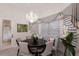 Cozy breakfast nook with decorative chandelier and lots of natural light at 5804 Mulligan Way, Lakewood Ranch, FL 34211