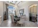 Bright dining room showcasing coffered ceilings, tile floors, and a built-in wine cooler at 5804 Mulligan Way, Lakewood Ranch, FL 34211