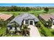 Home featuring a barrel tile roof and paver driveway in a golf course community at 5804 Mulligan Way, Lakewood Ranch, FL 34211