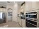 Well-equipped kitchen with stainless steel appliances, custom cabinets, and ample counter space at 5804 Mulligan Way, Lakewood Ranch, FL 34211