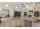 Spacious kitchen with island seating that flows into a living and dining area at 5804 Mulligan Way, Lakewood Ranch, FL 34211