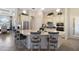Gourmet kitchen featuring a large island, stainless steel appliances, and custom cabinetry at 5804 Mulligan Way, Lakewood Ranch, FL 34211