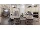 Bright kitchen featuring a large island with seating and stainless steel appliances at 5804 Mulligan Way, Lakewood Ranch, FL 34211