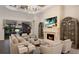 Spacious living room with fireplace, built-in cabinets and golf course view at 5804 Mulligan Way, Lakewood Ranch, FL 34211
