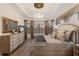 Serene main bedroom with custom ceiling and decorative window treatments at 5804 Mulligan Way, Lakewood Ranch, FL 34211