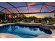 Sparkling pool and spa area with beautiful sunset views and lush landscaping at 5804 Mulligan Way, Lakewood Ranch, FL 34211