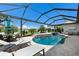 Relaxing screened-in pool and spa with elegant water features, surrounded by a serene landscape and comfortable seating at 5804 Mulligan Way, Lakewood Ranch, FL 34211