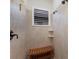Walk-in shower with tile surround, a window and a built-in bench at 5804 Mulligan Way, Lakewood Ranch, FL 34211