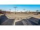Well-maintained tennis courts with professional lighting and secure fencing for recreational play at 5804 Mulligan Way, Lakewood Ranch, FL 34211