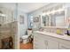 Bright bathroom featuring a walk-in shower, wood floors, and a vanity with marble countertop at 6002 34Th W Ave, Bradenton, FL 34209