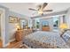 Bright bedroom with wood floors, ceiling fan, and serene decor offering a relaxing space at 6002 34Th W Ave, Bradenton, FL 34209