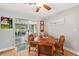 Charming dining area featuring a wooden table with seating and sliding glass doors to the outdoor patio at 6002 34Th W Ave, Bradenton, FL 34209