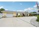 Attractive single-story home with attached garage, vibrant landscaping, and spacious driveway at 6002 34Th W Ave, Bradenton, FL 34209