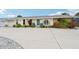 Charming single-story home with blue entry door, well maintained landscaping, and large driveway at 6002 34Th W Ave, Bradenton, FL 34209