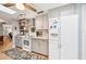 Bright kitchen featuring modern appliances, light gray cabinets, and wood flooring with a decorative rug at 6002 34Th W Ave, Bradenton, FL 34209